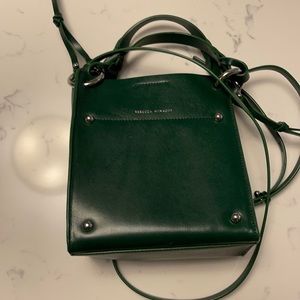 Beautiful dark green bag, only used a handful of times. Can fit a lot of stuff